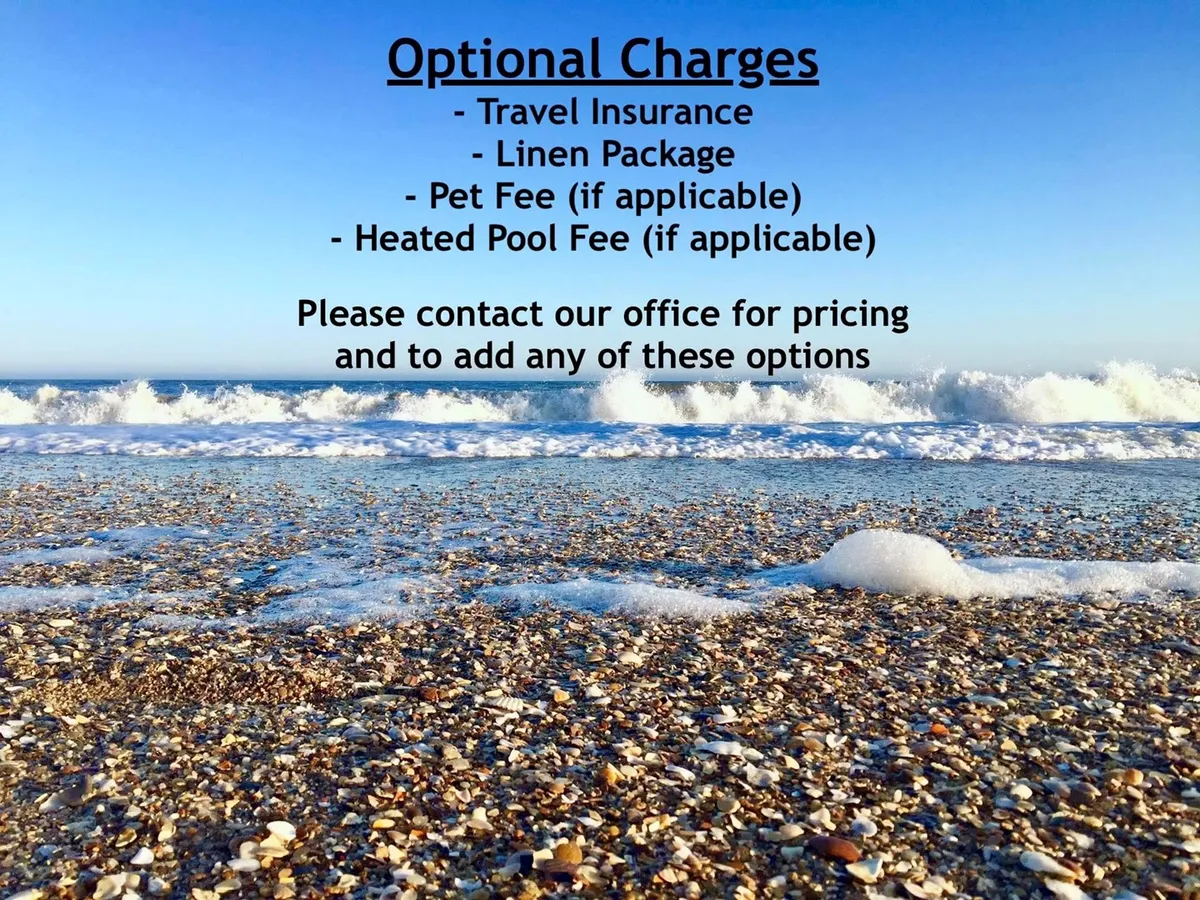 A serene, expansive view of the beach with gentle waves lapping the sandy shore. Seashells are scattered across the sand, and the soft light of sunset creates a tranquil atmosphere. The image captures the essence of beach walks and the open shoreline, ideal for dog-friendly strolls.